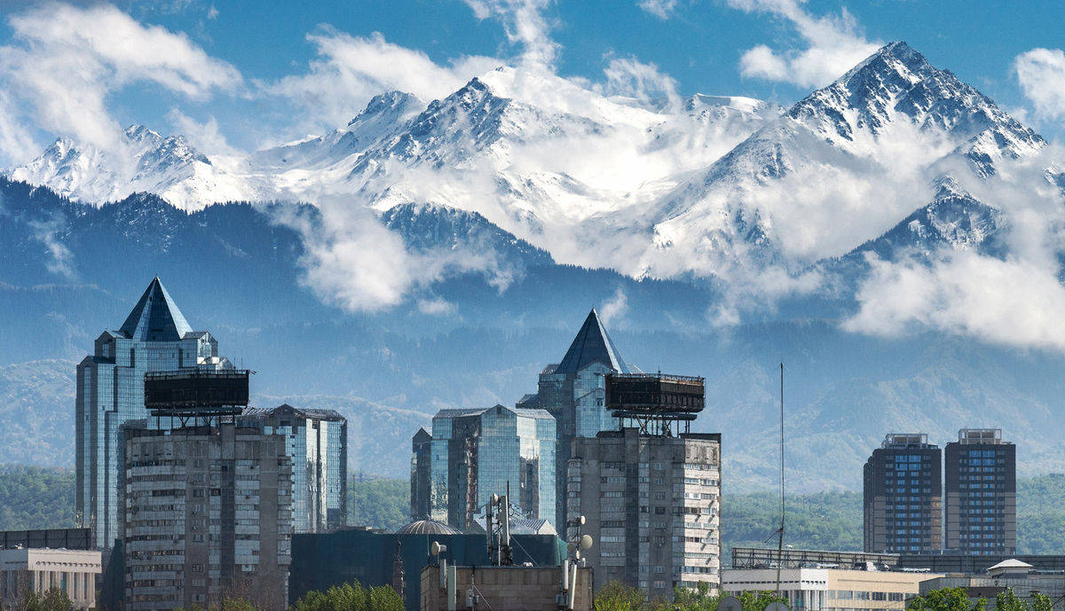 Majestic Icy Mountains Of Almaty, Kazakhstan Background