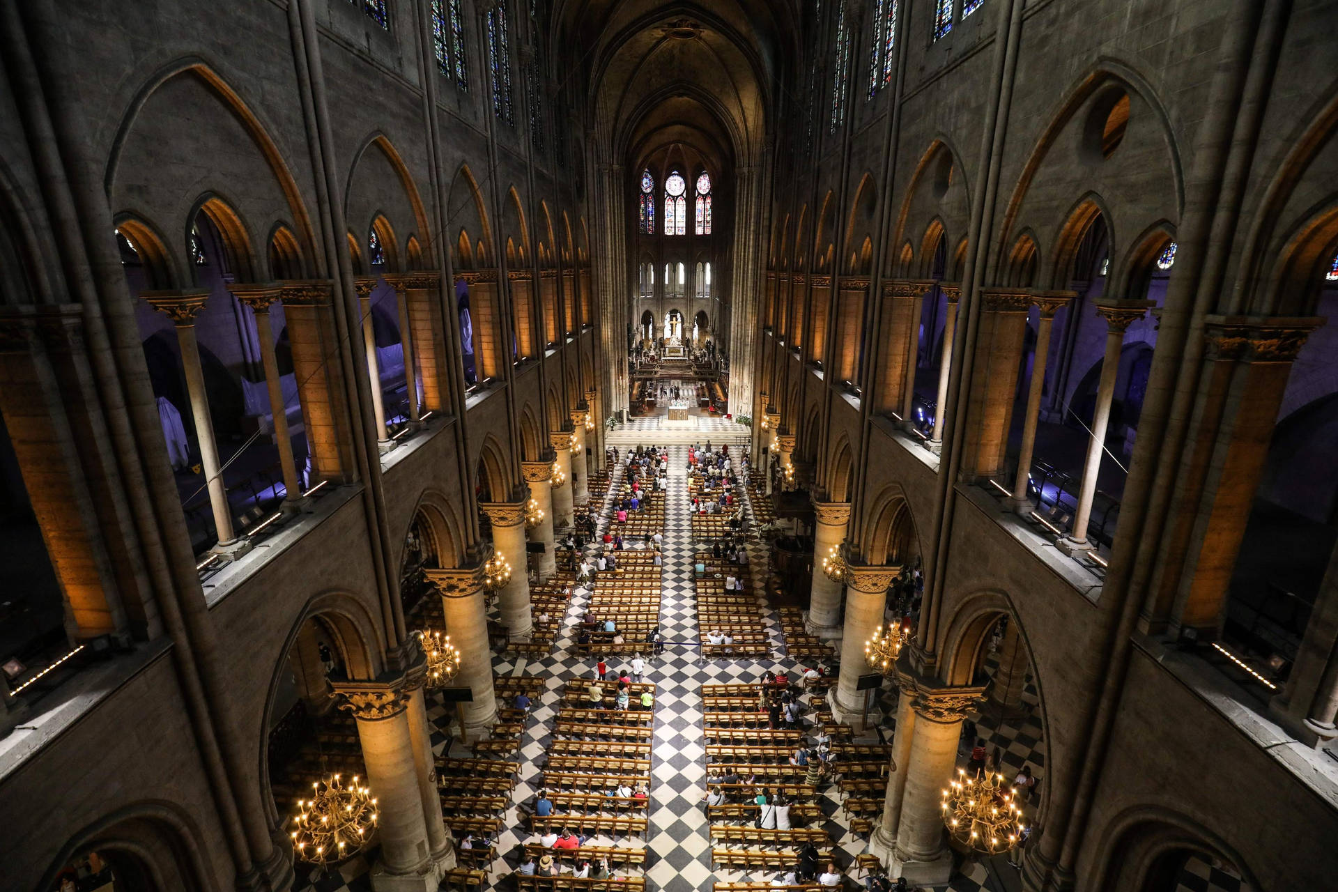 Majestic Interior Of The Notre Dame Cathedral Background