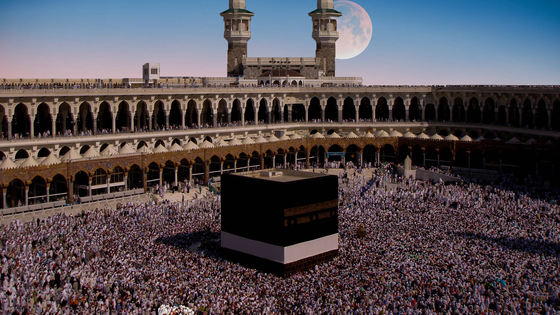 Majestic Kaaba Under The Gleaming Full Moon Background