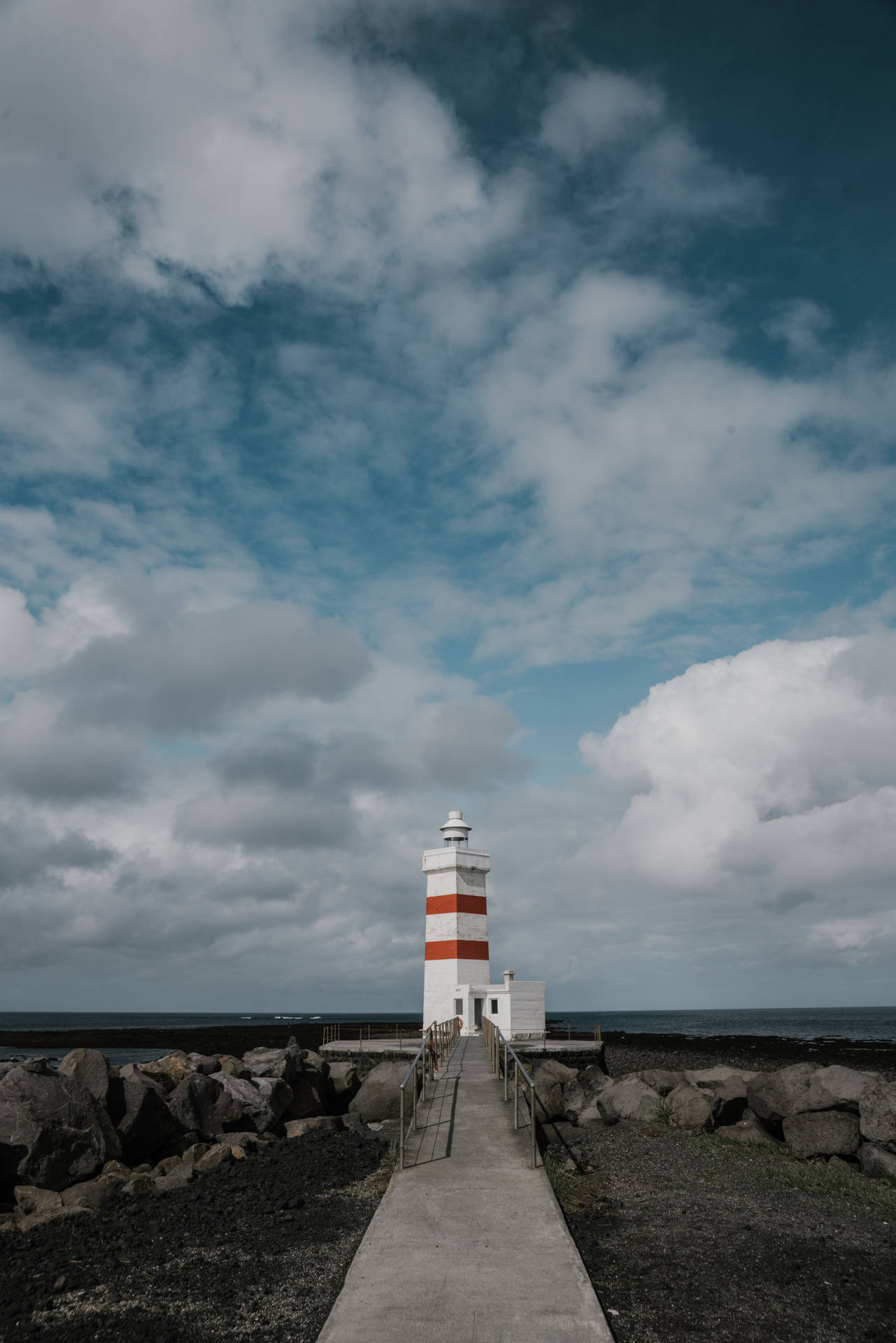 Majestic Lighthouse Under Gray Cloudy Skies