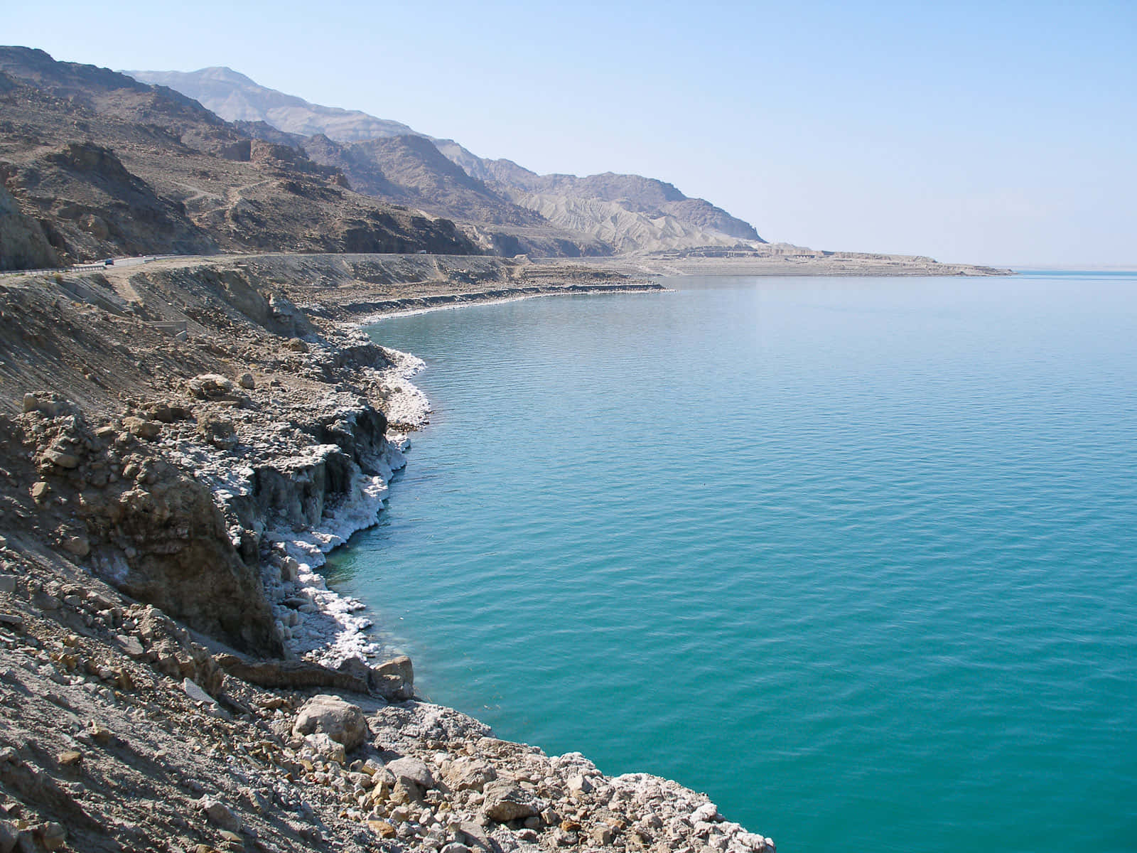 Majestic Low-hanging Rocky Cliff By The Dead Sea Background
