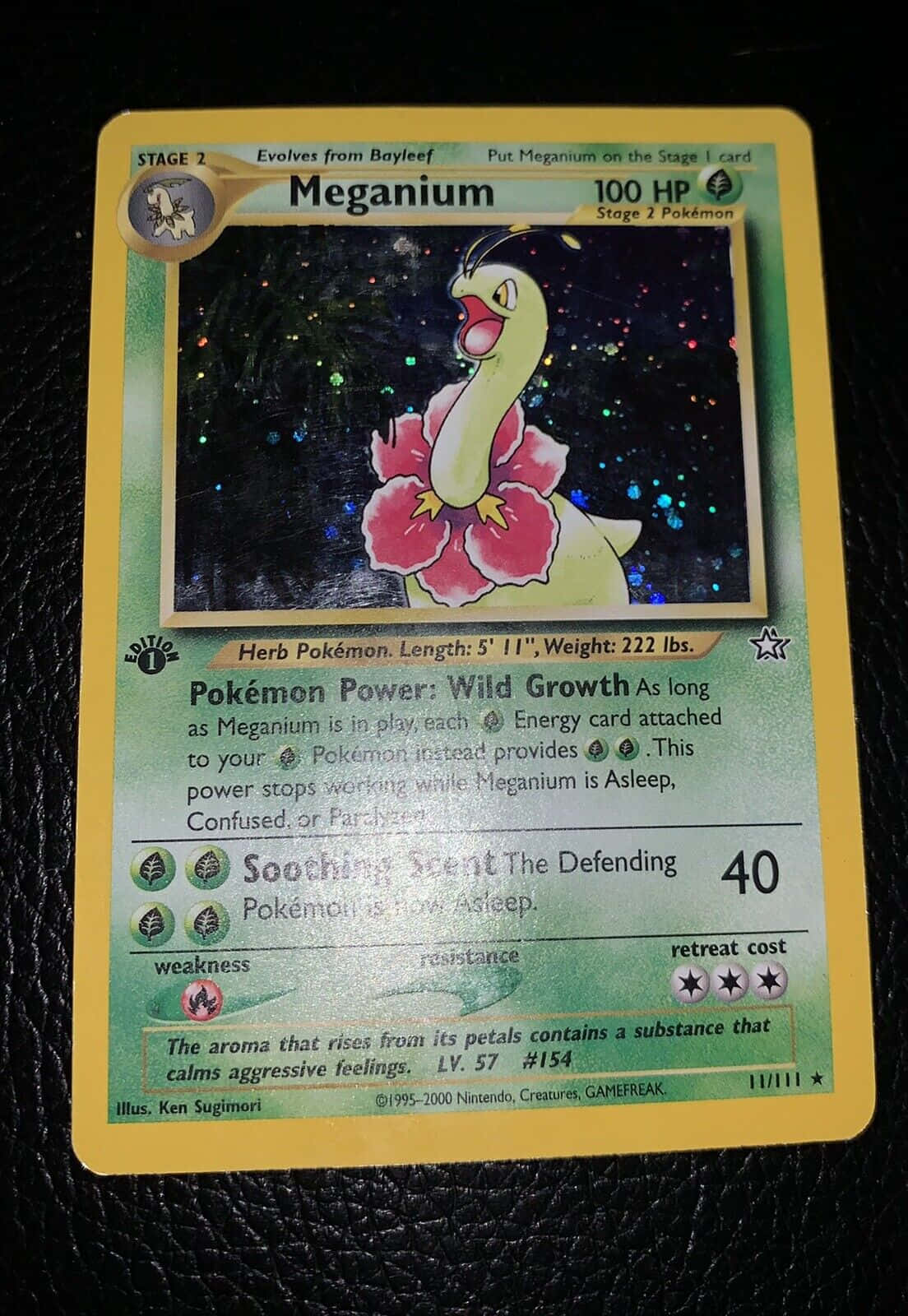Majestic Meganium Pokemon Trading Card On Leather Background Background