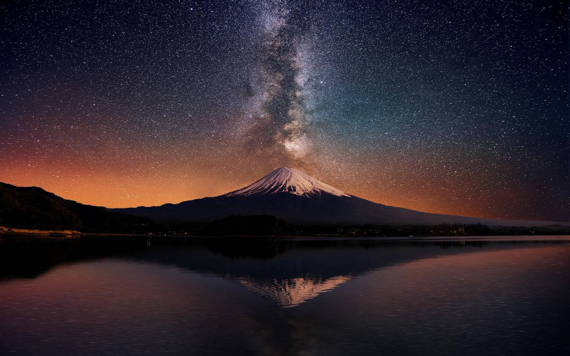 Majestic Night Sky Over Serene Mountain Landscape Background