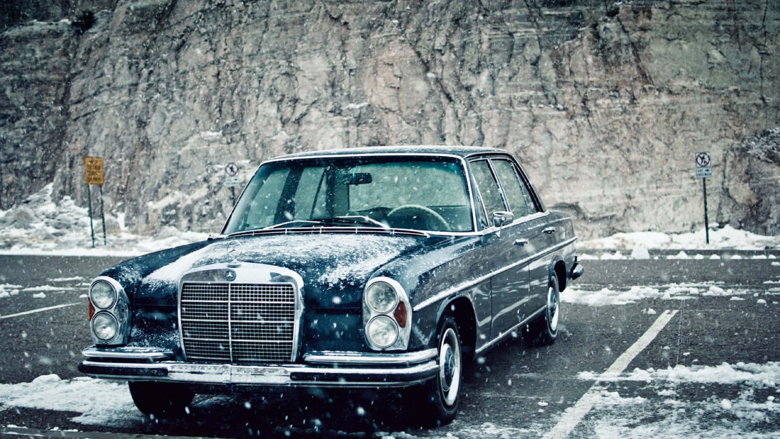 Majestic Old Mercedes Amidst The Snowy Mountains