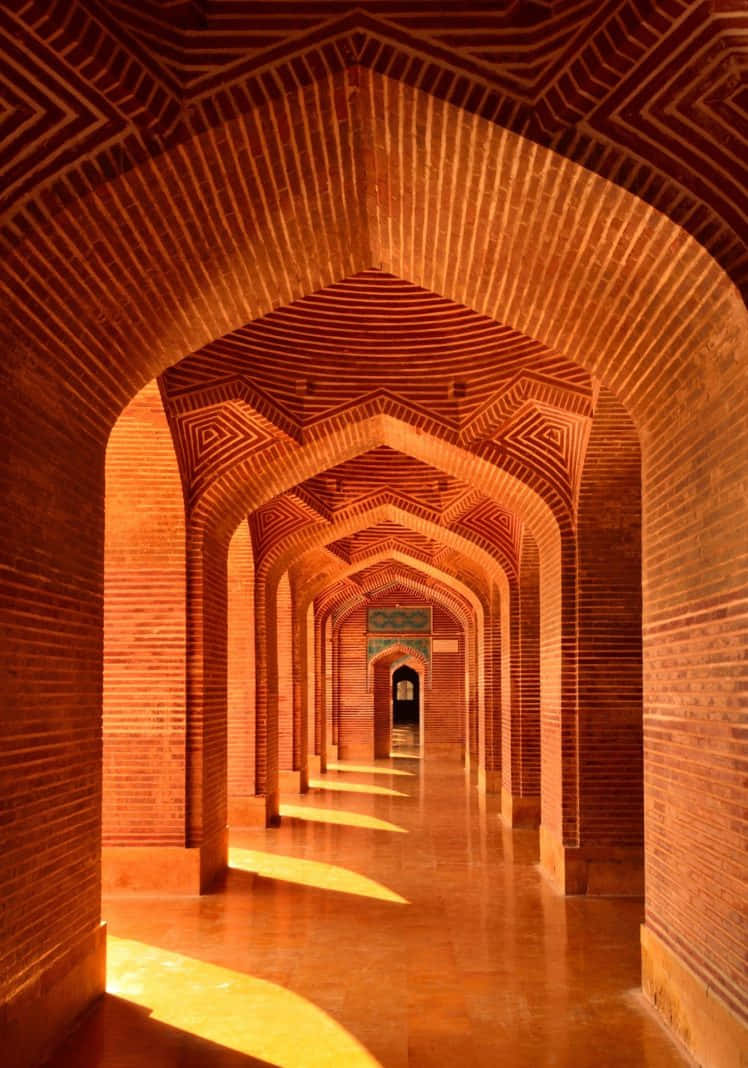 Majestic Pillar Of Shah Jahan Mosque At Golden Hour Background