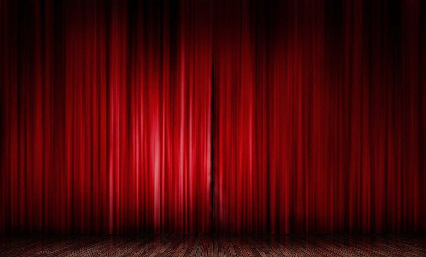 Majestic Red Curtains Of A Closed Theatre Stage Background