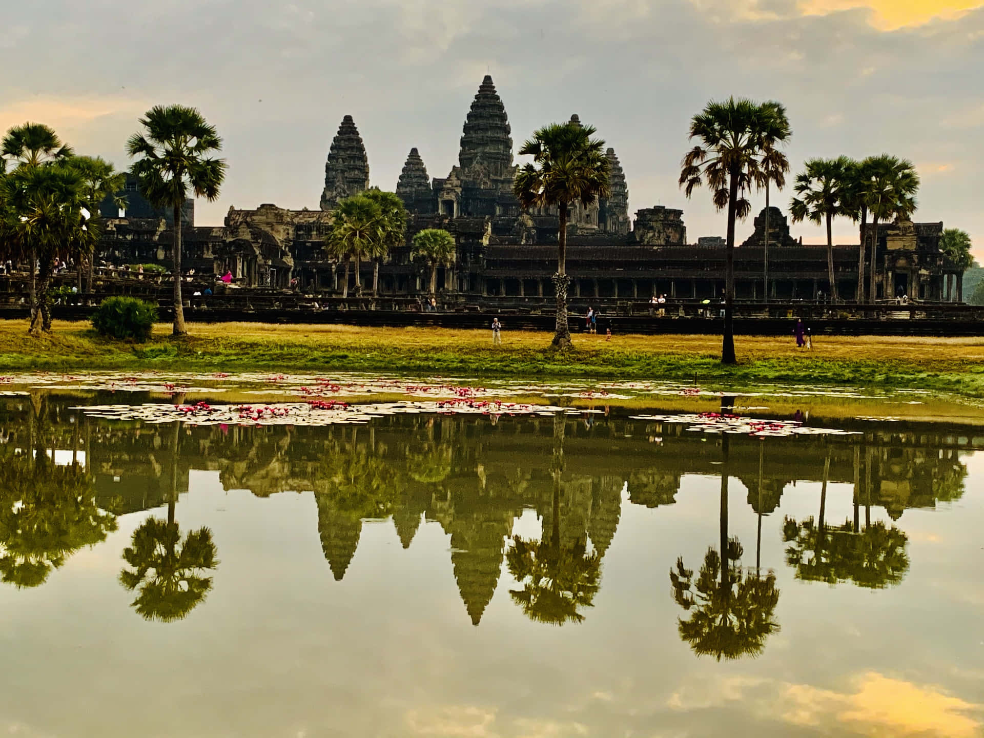 Majestic Reflection Of Angkor Thom In Water Background