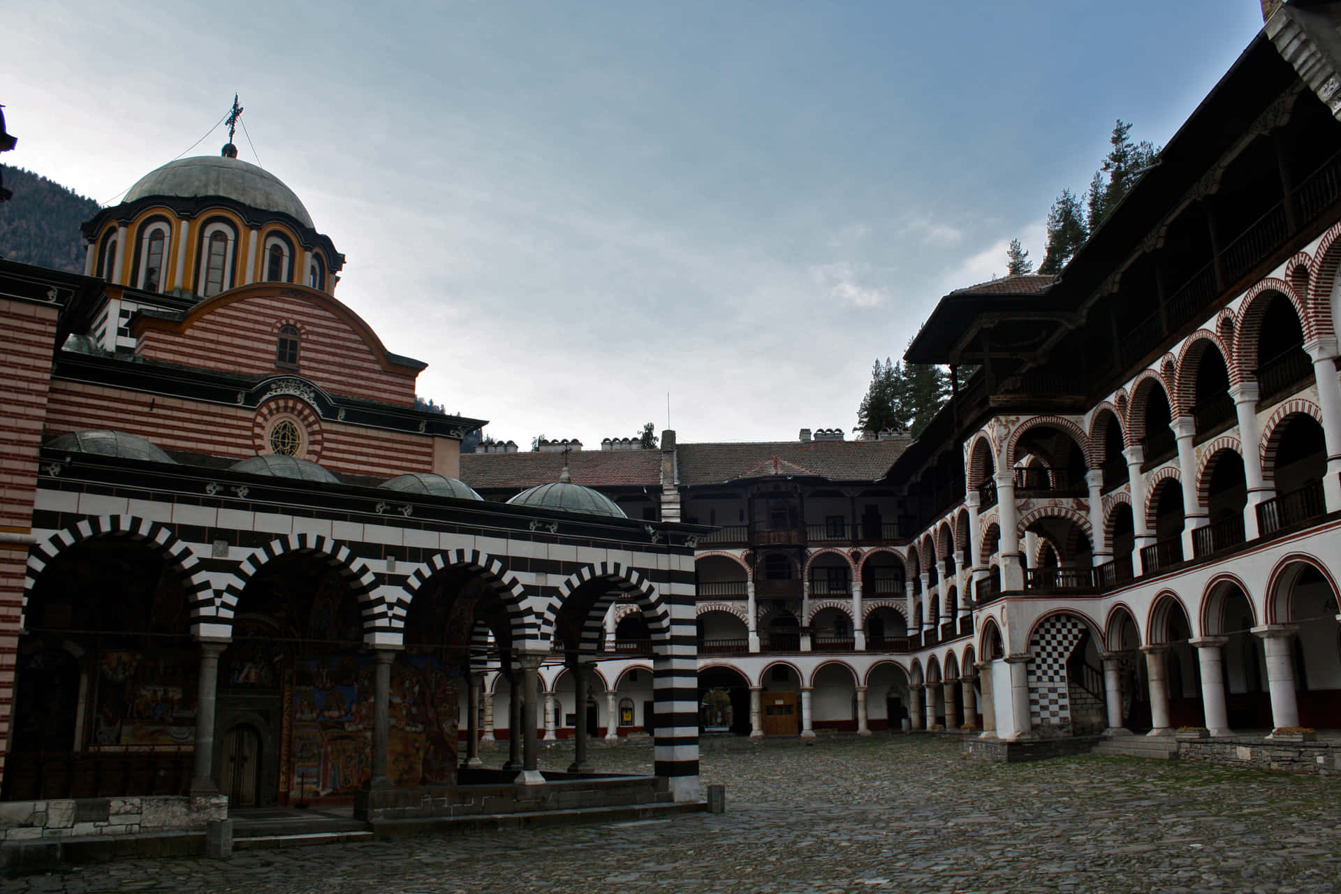 Majestic Rila Monastery Against The Backdrop Of Beautiful Mountain Landscapes Background