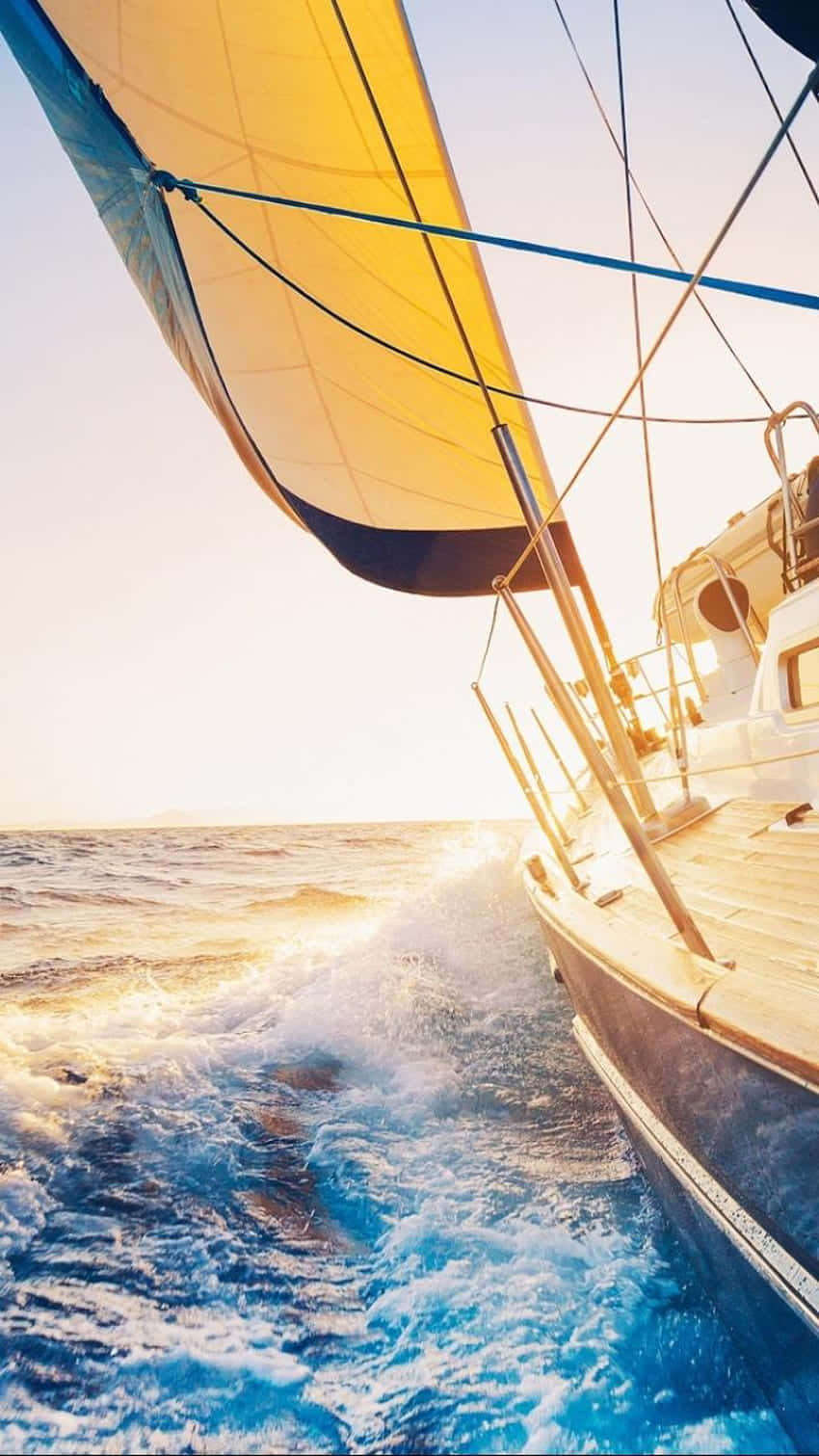 Majestic Sailboat On The Horizon Background