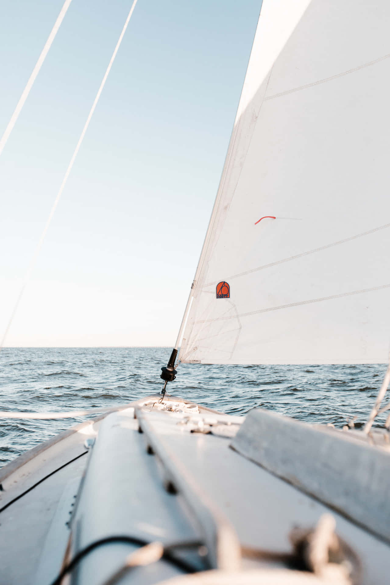 Majestic Sailboat On Tranquil Sea Background