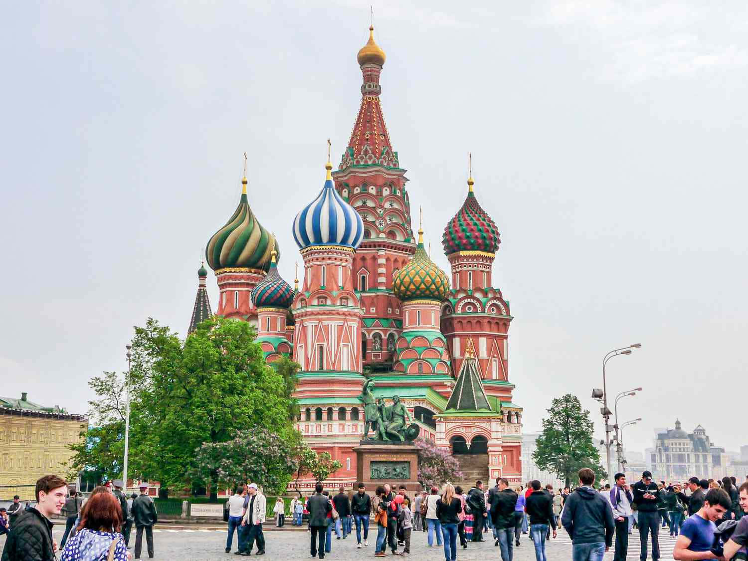 Majestic Saint Basil's Cathedral Illuminated In Red Square Background
