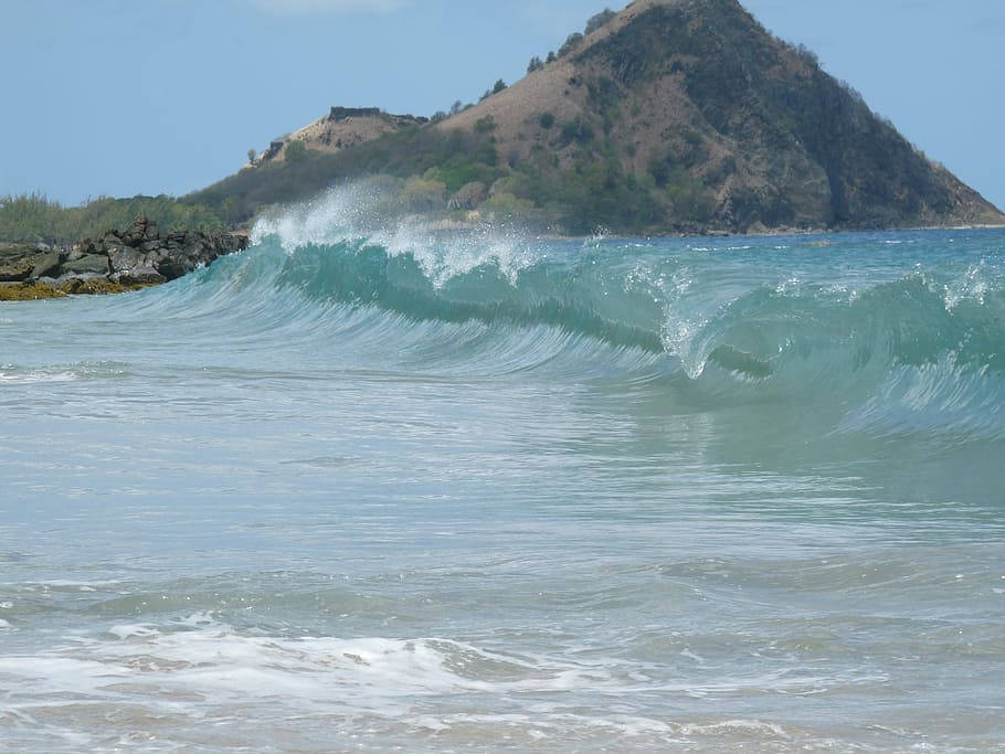 Majestic Sea Waves On St. Lucia Shoreline Background