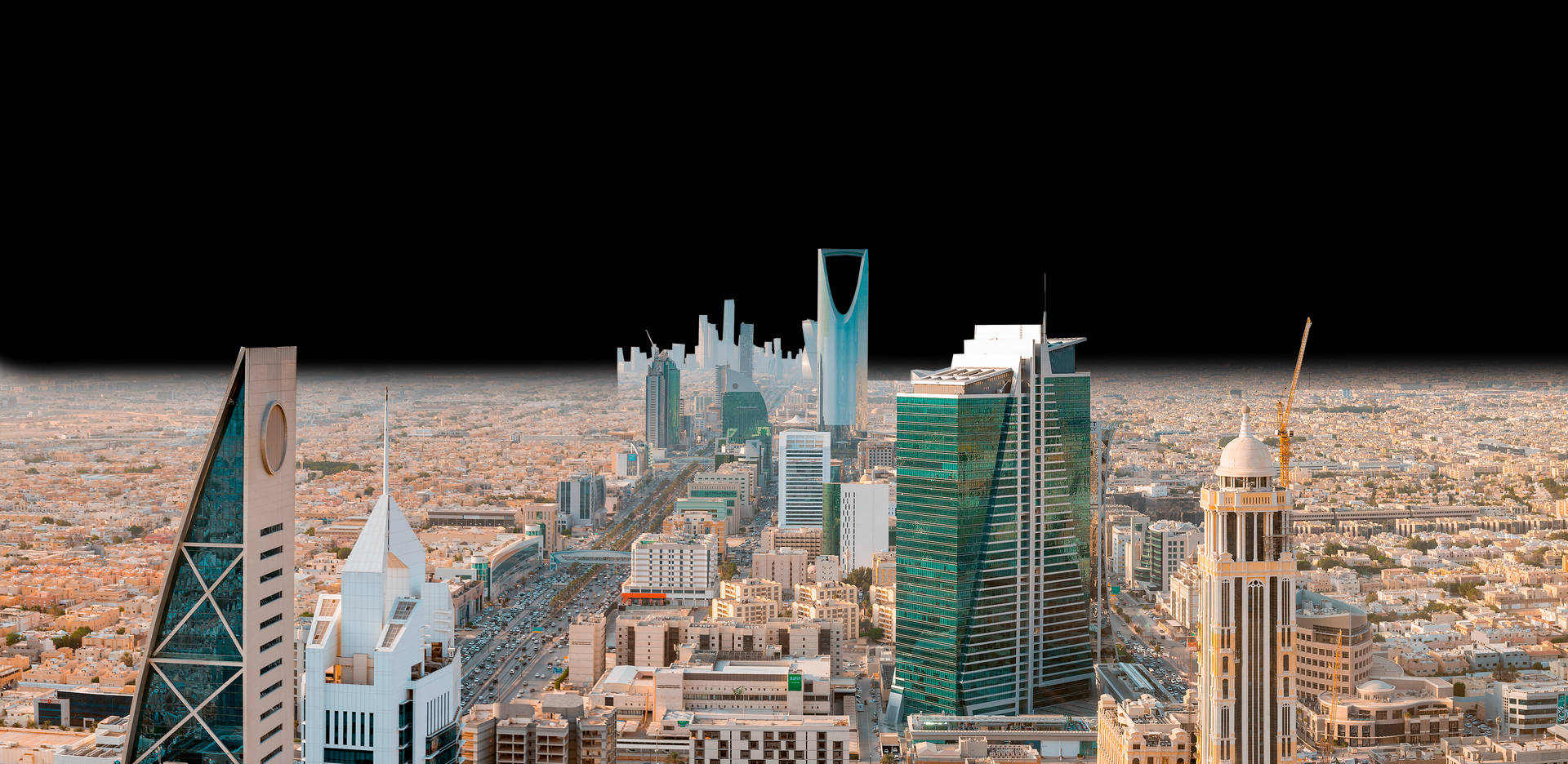 Majestic Skyscrapers Towering Over Riyadh Background