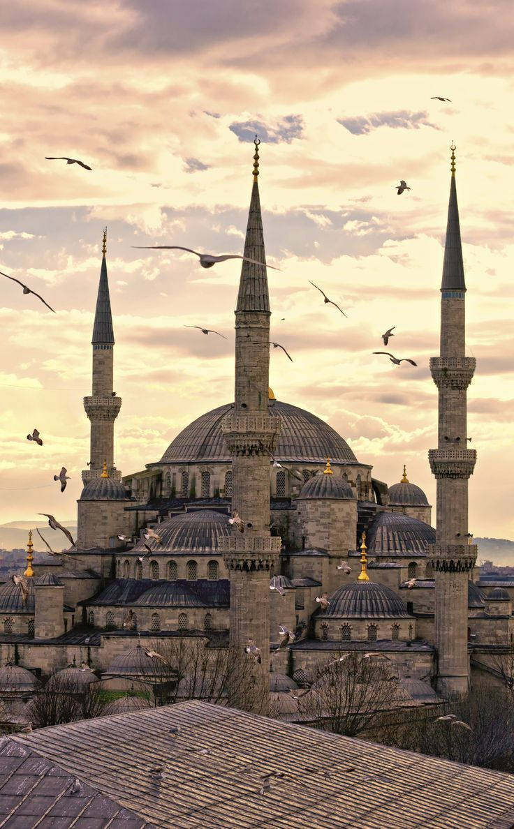 Majestic Spires Of Hagia Sophia Against A Sunset Sky