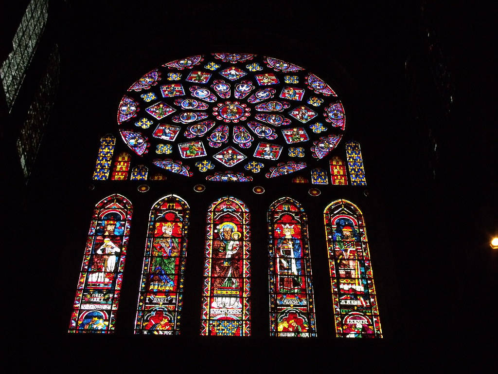 Majestic Stained Glass Artistry In Chartres Cathedral Background