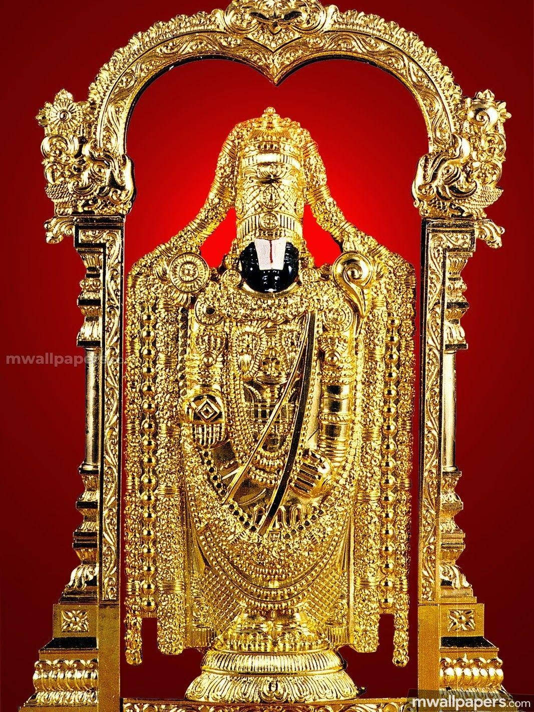 Majestic Statue Of Lord Venkateswara In Tirupati Balaji Background