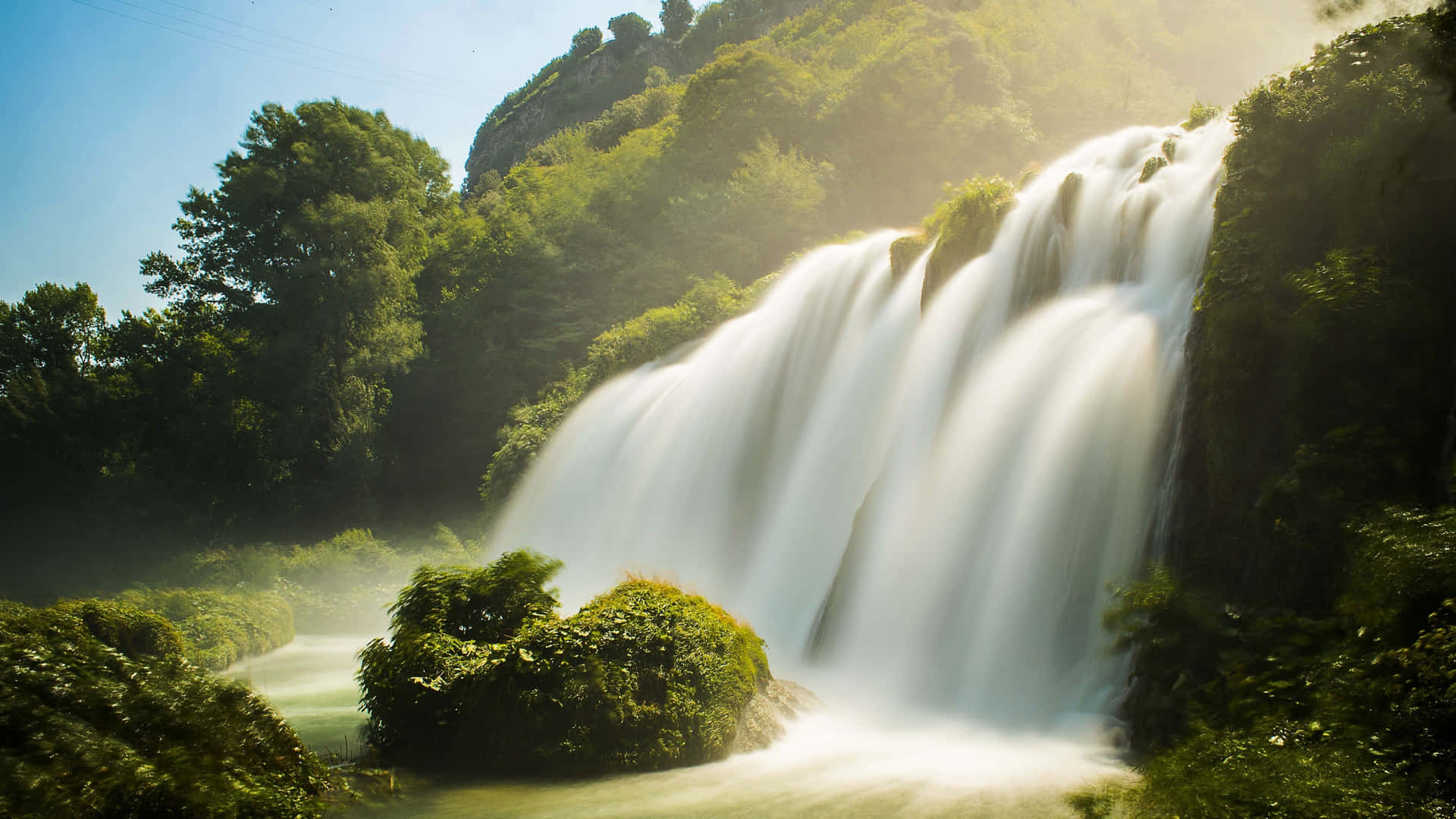 Majestic_ Sunlit_ Waterfall_4 K_ Ultra_ Wide.jpg Background