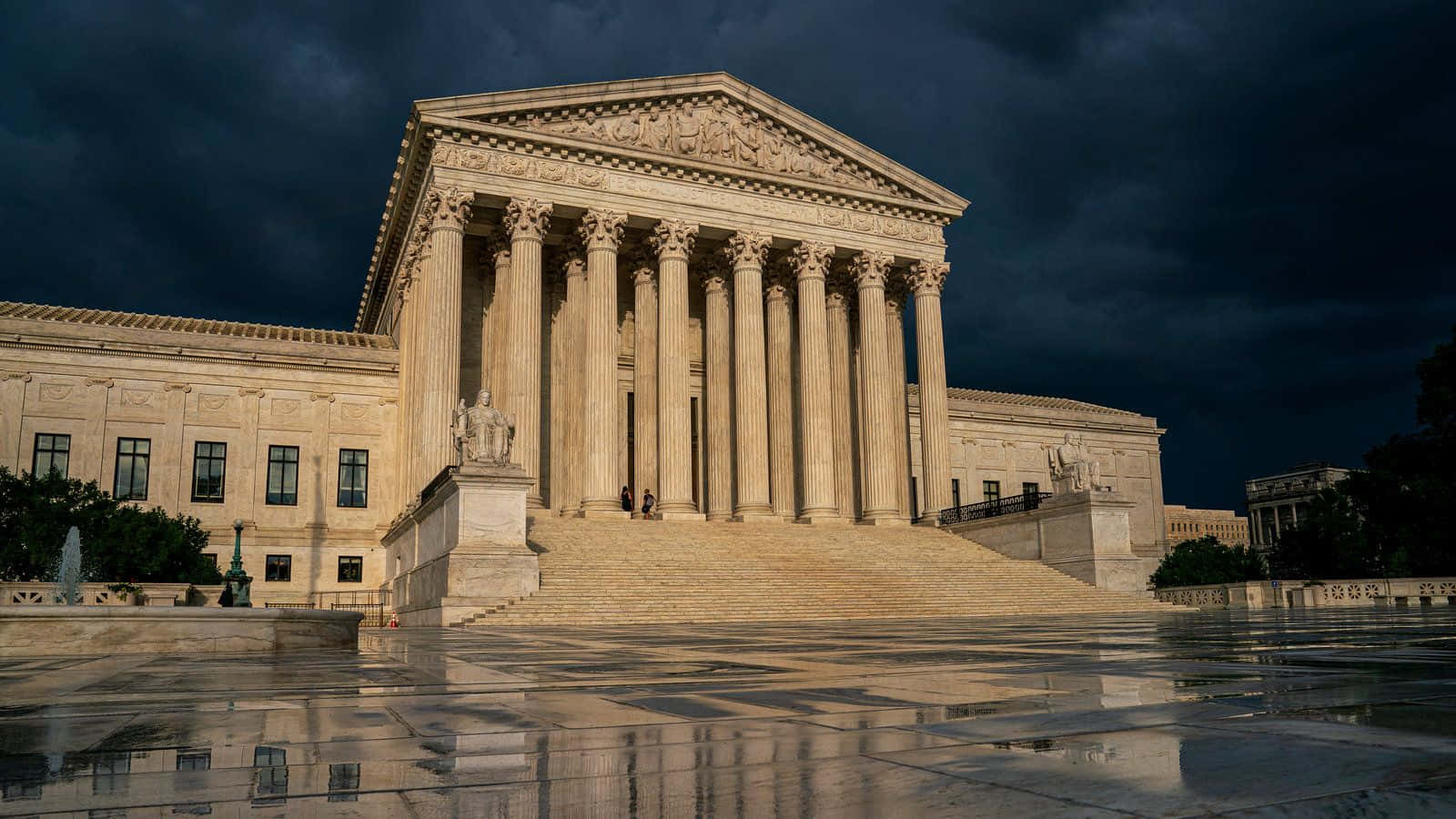 Majestic Supreme Court Building Under Rainy Sky Background