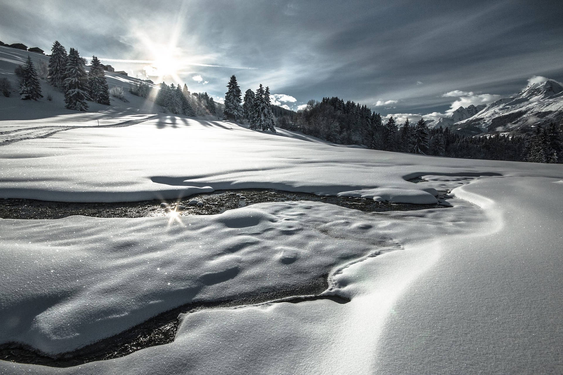 Majestic Swiss Alps Blanketed In Snow Background