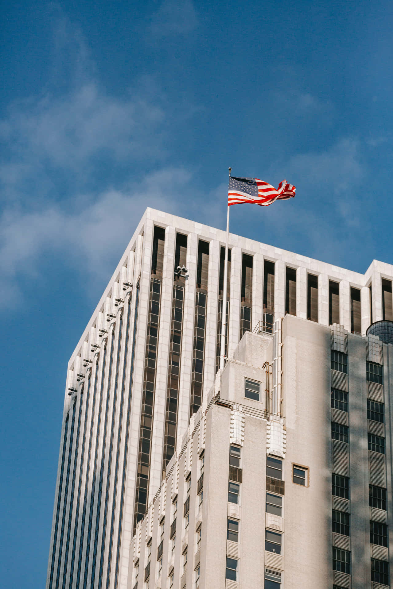 Majestic U.s. Flag Fluttering In The Sky Background