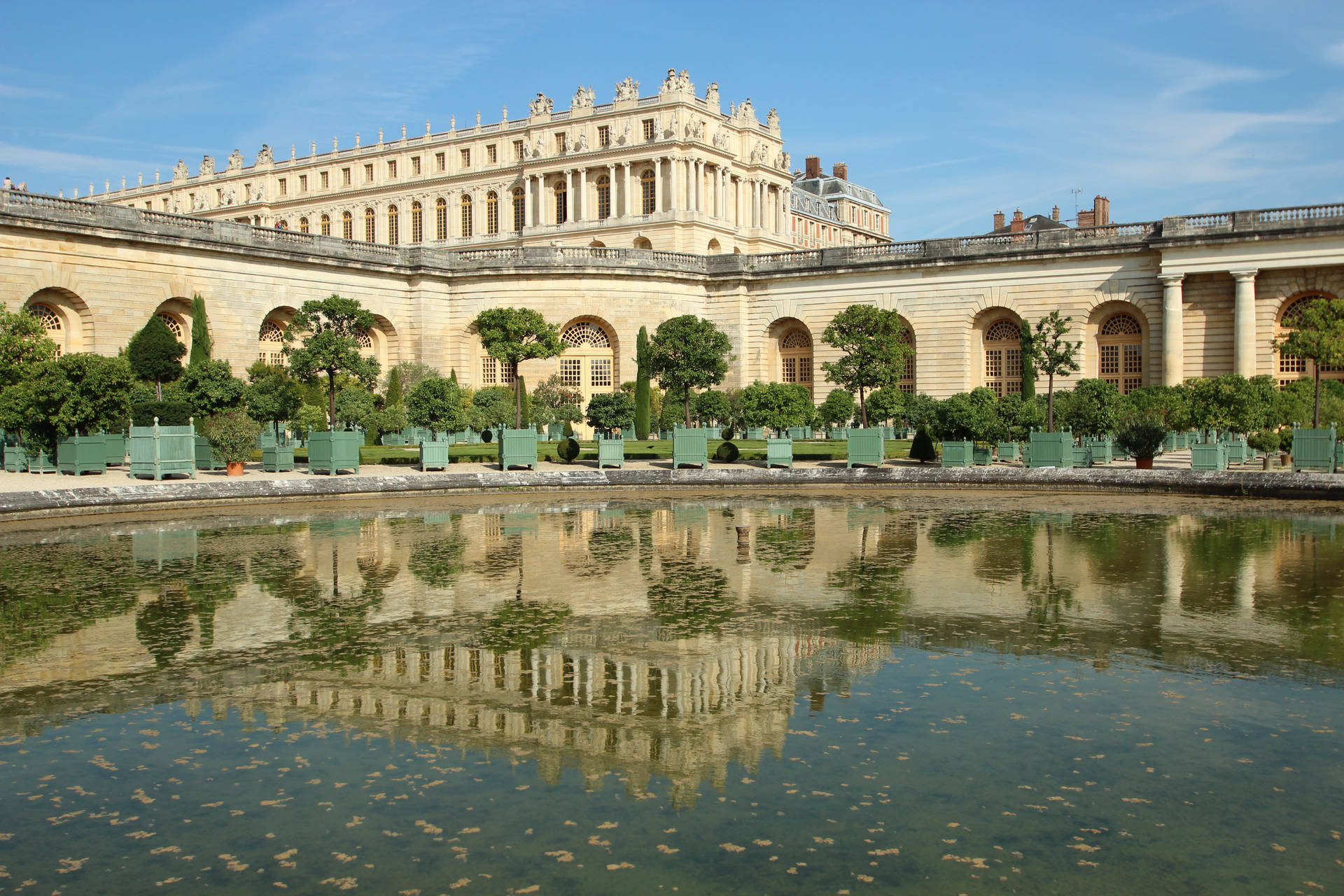 Majestic Versailles Orangerie Against A Clear Blue Sky Background