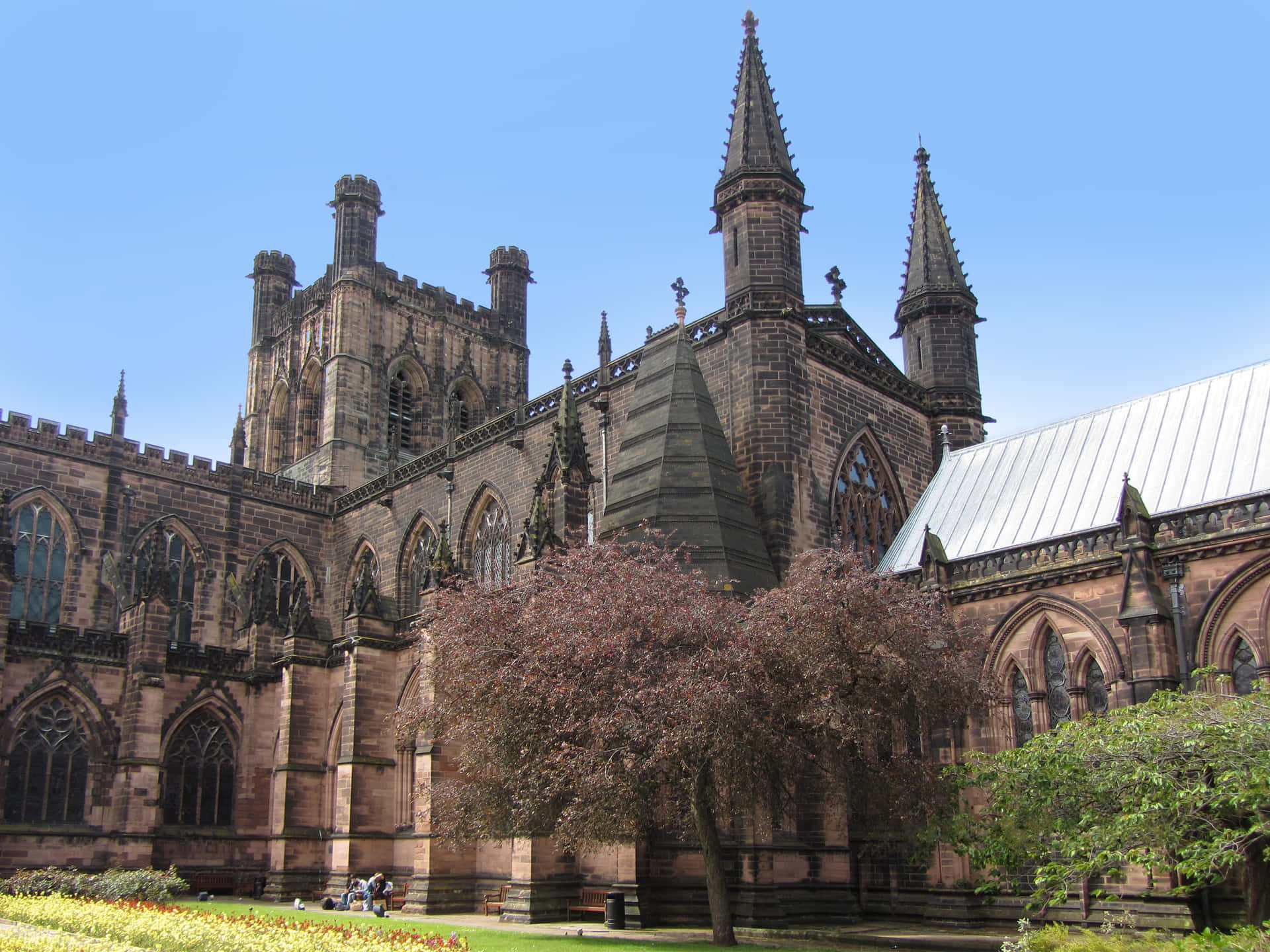 Majestic View Of Chester Cathedral Amidst Greenery Background
