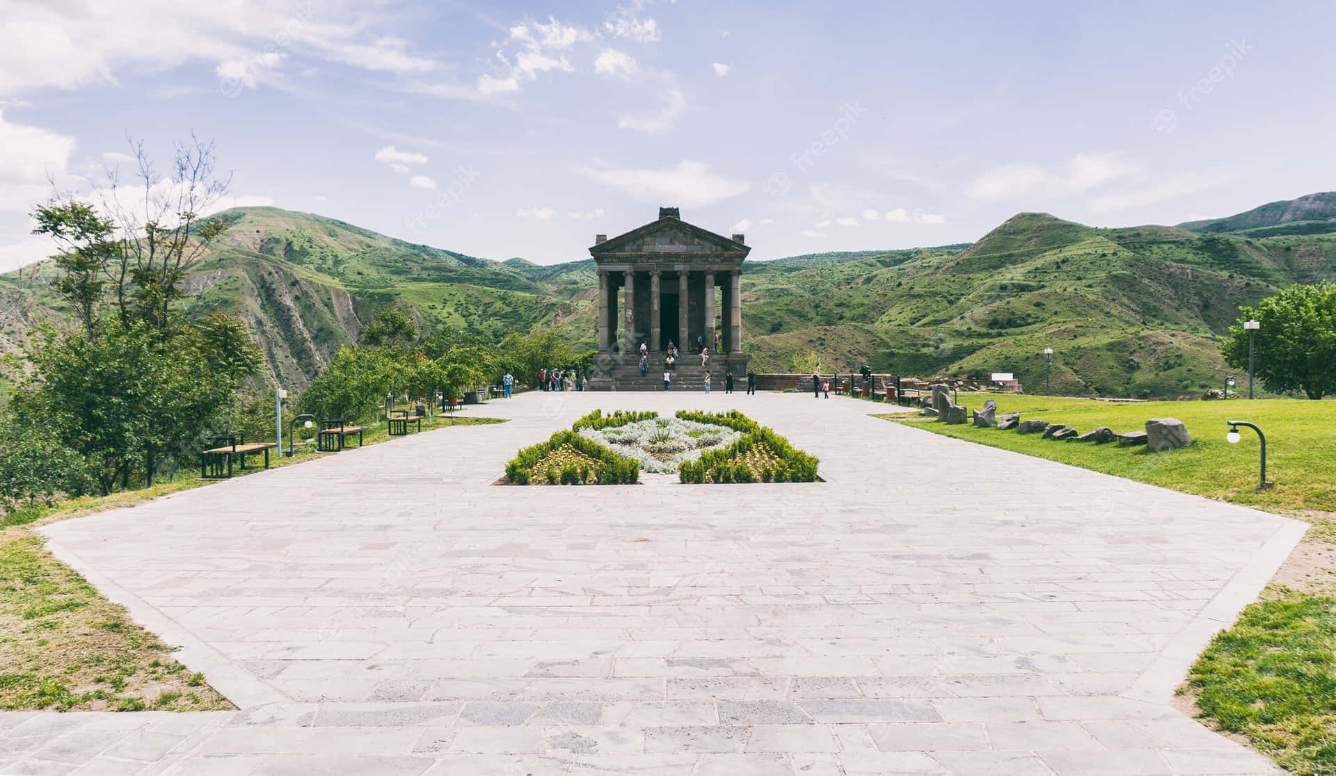 Majestic View Of Garni Temple With Scenic Walkway Background