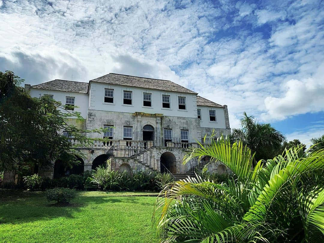 Majestic View Of Rose Hall Great House With A Dramatic Cloudscape