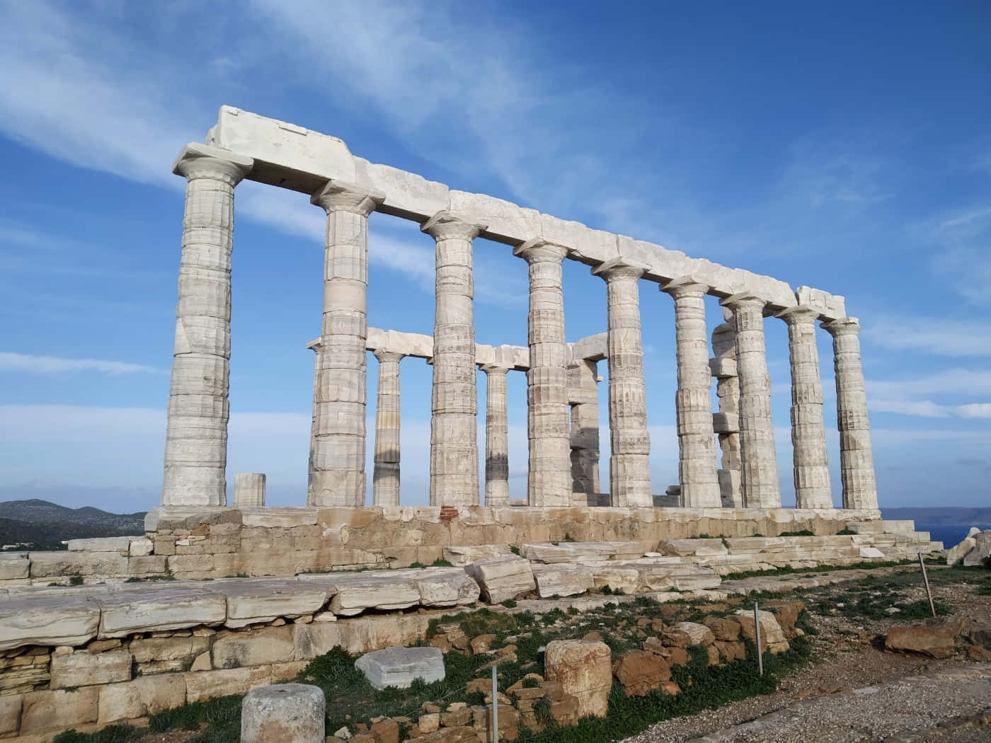 Majestic View Of The Ancient Temple Of Poseidon Background