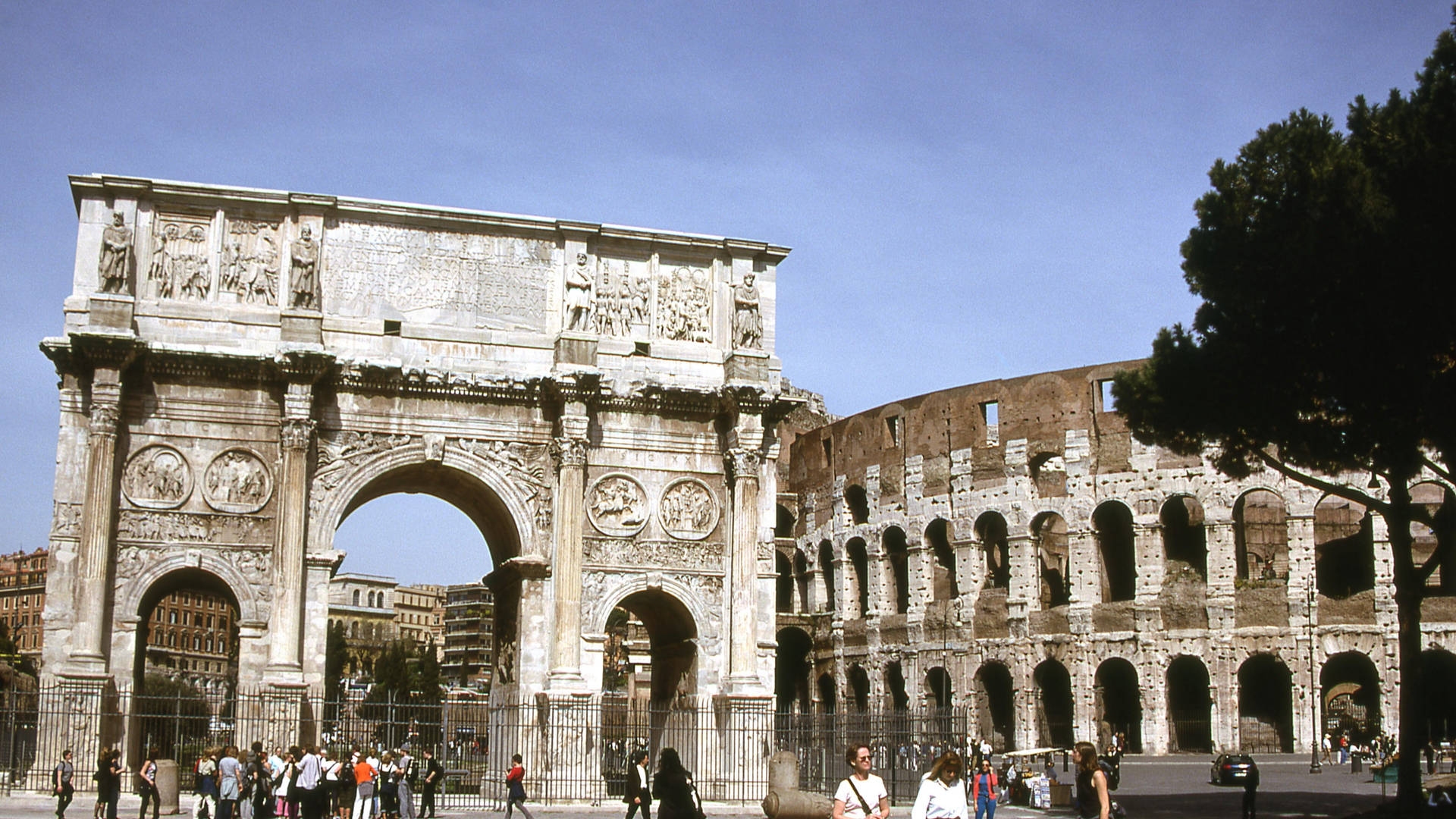 Majestic View Of The Arch Of Constantine With The Colosseum In The Background Background