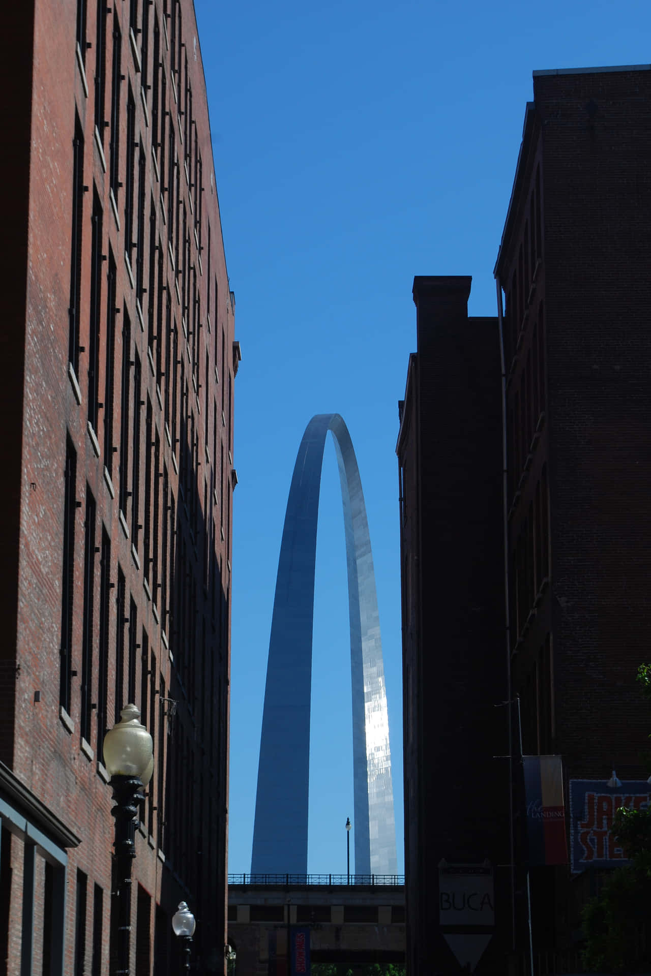 Majestic View Of The Gateway Arch With City Buildings Background