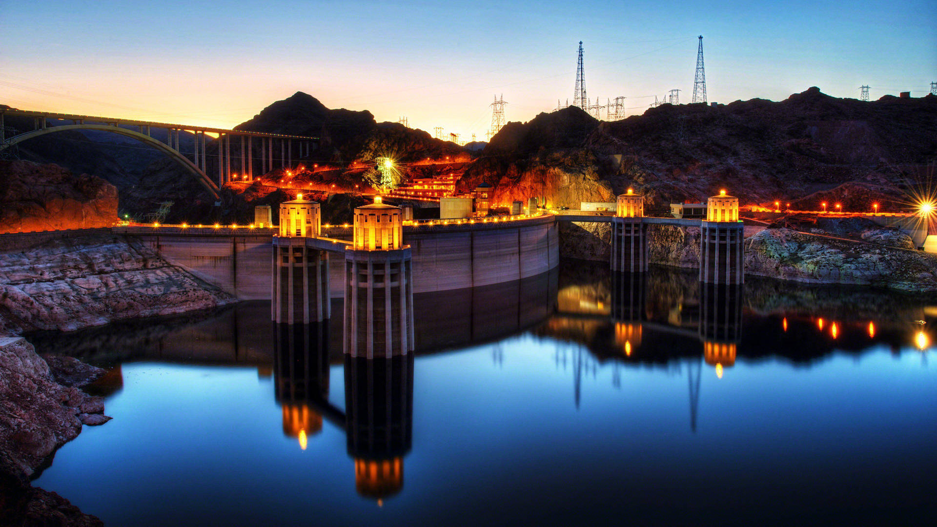 Majestic View Of The Hoover Dam With Stunning Reflections Background