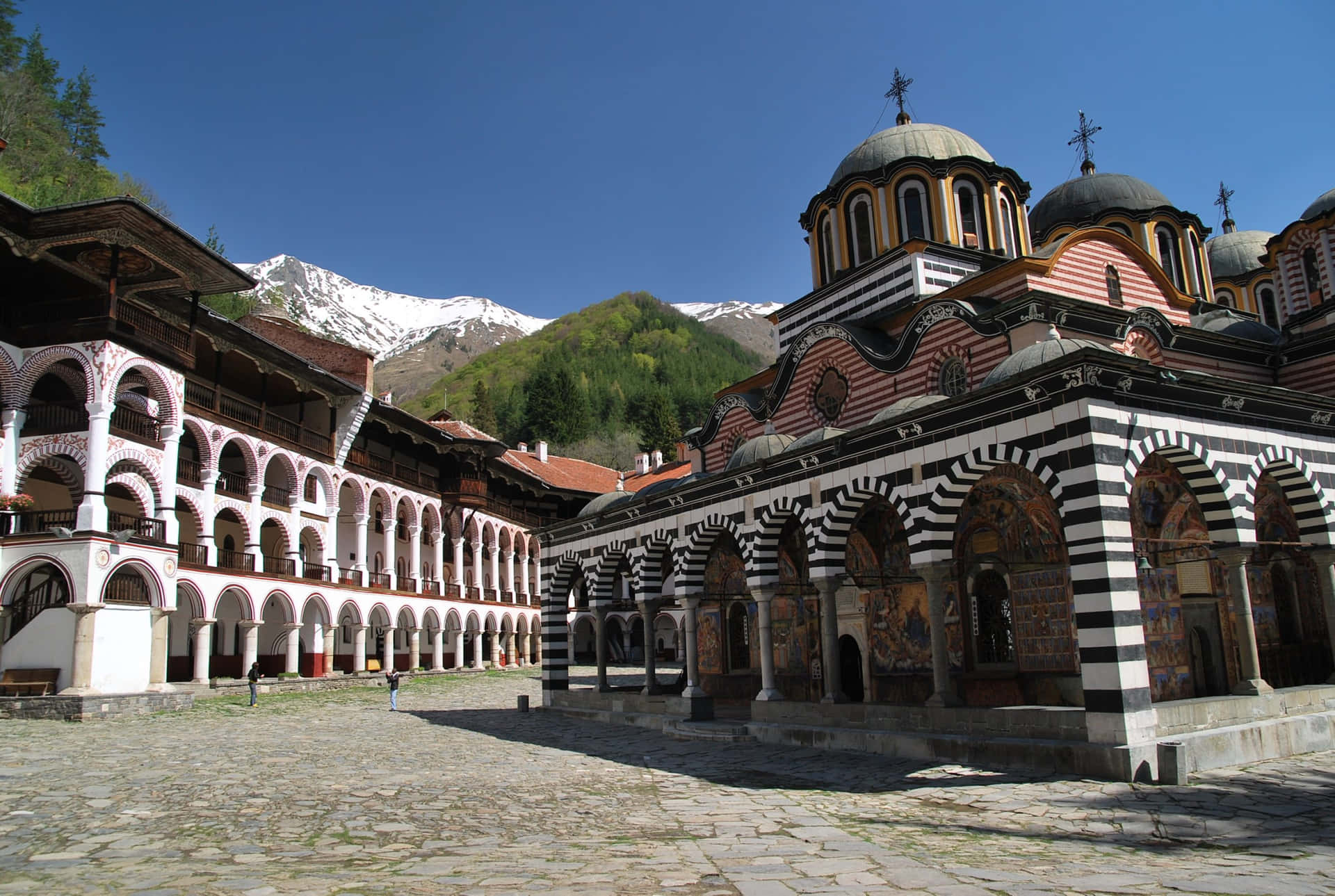 Majestic View Of The Rila Monastery Courtyard In Bulgaria Background
