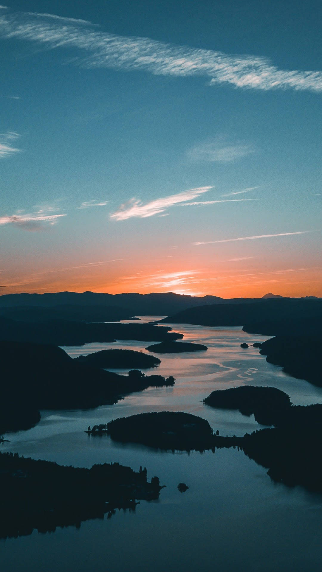 Majestic View Of The River Leading Towards The Horizon Background