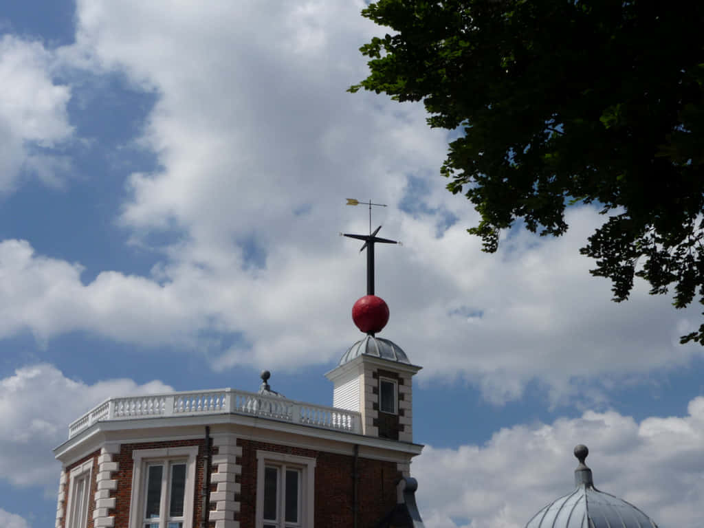 Majestic View Of The Royal Observatory Against A Vibrant Twilight Sky. Background