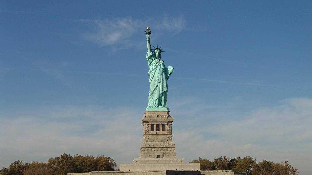 Majestic View Of The Statue Of Liberty Background