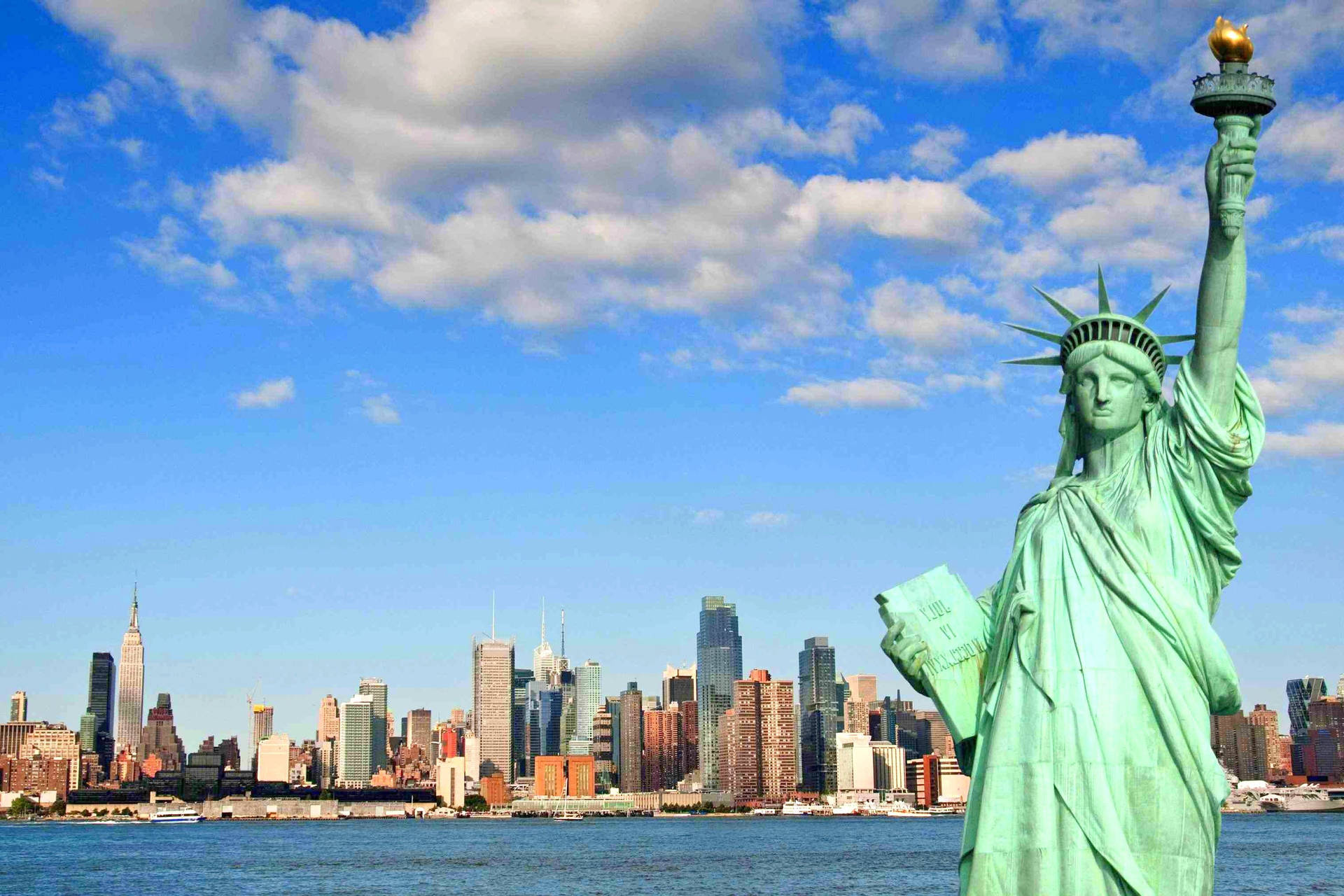 Majestic View Of The Statue Of Liberty Background