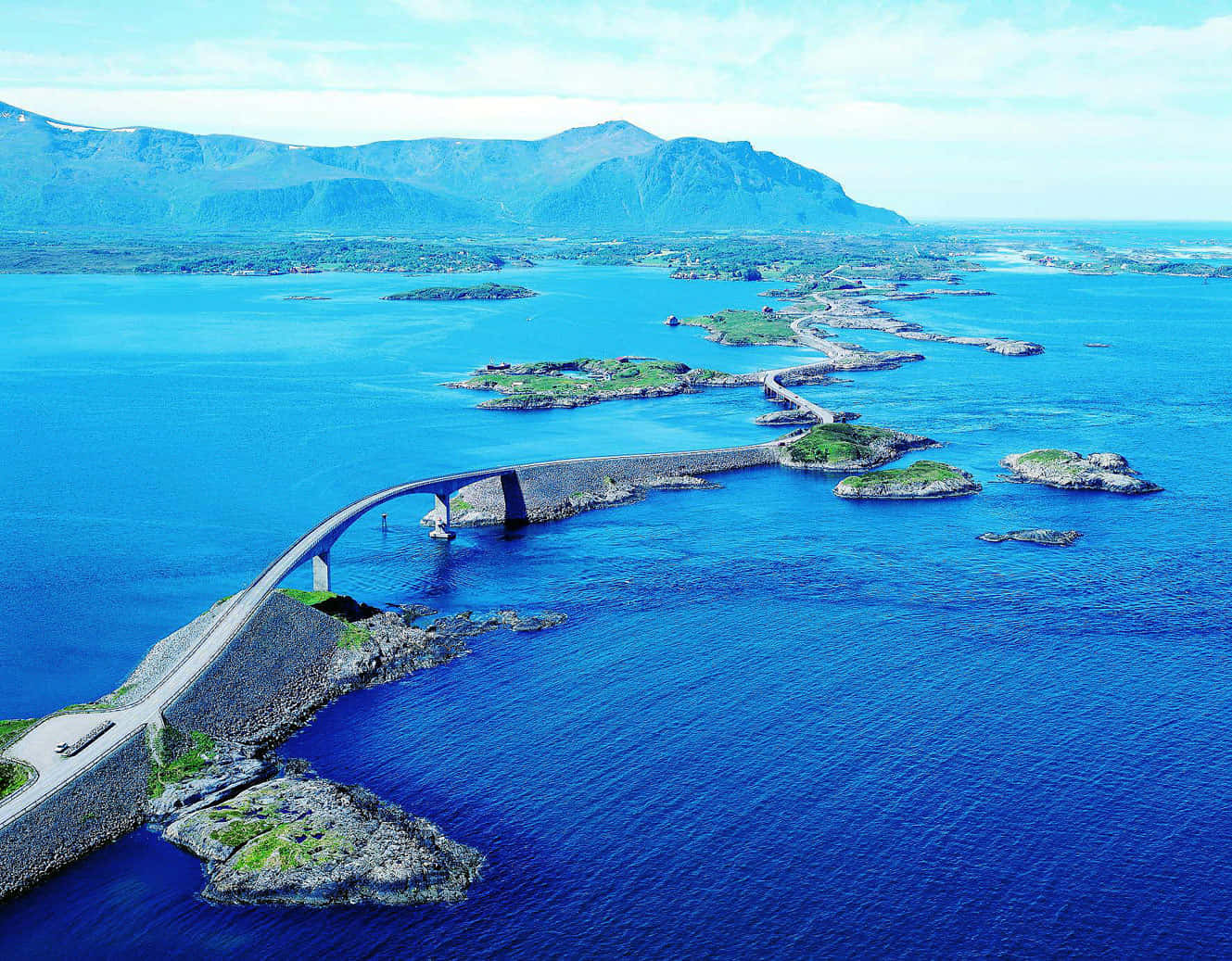 Majestic View Of The Storseisundet Bridge Across The Serene Waterfront Background