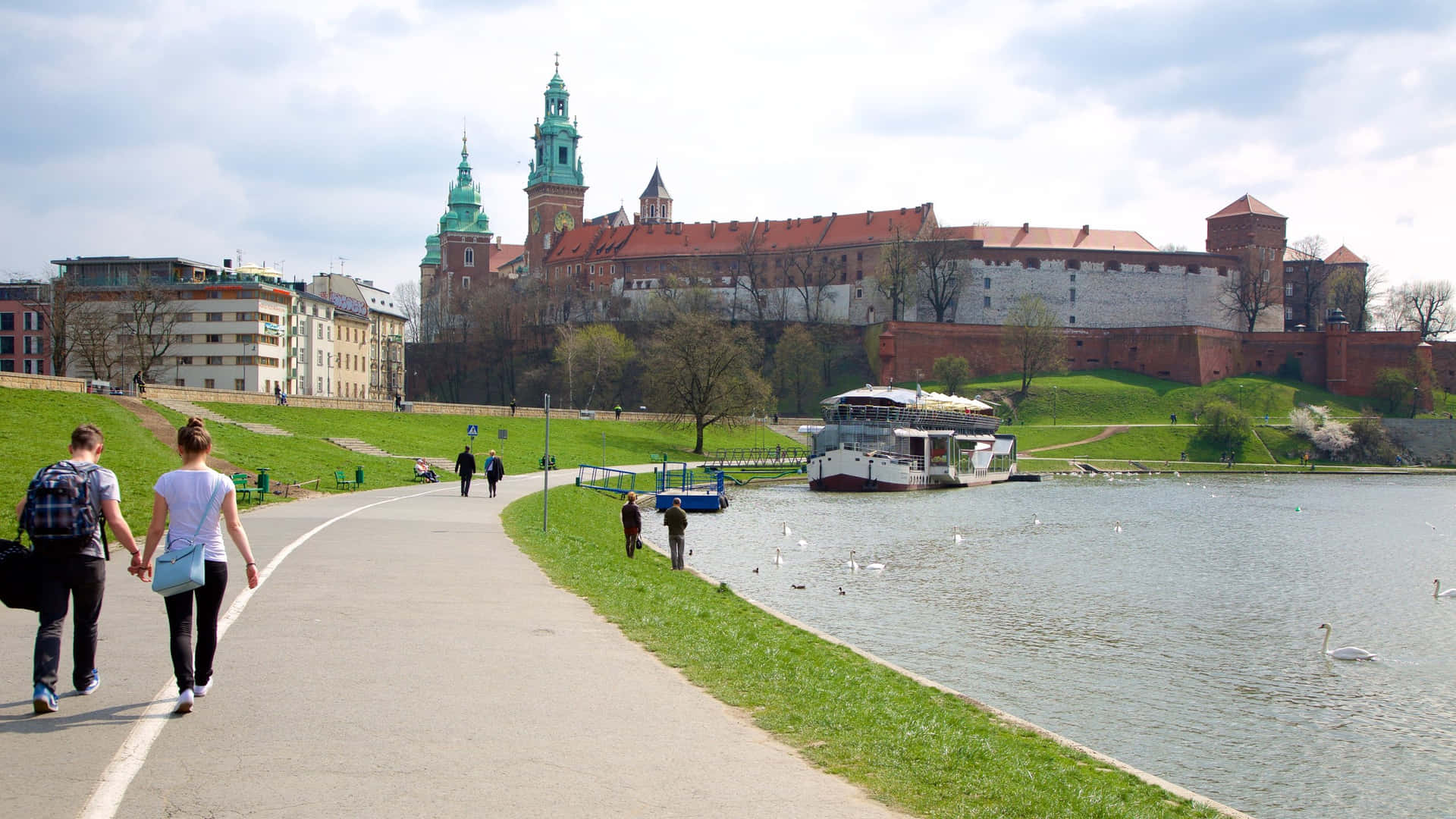 Majestic View Of Wawel Castle By The River In Kraków, Poland Background