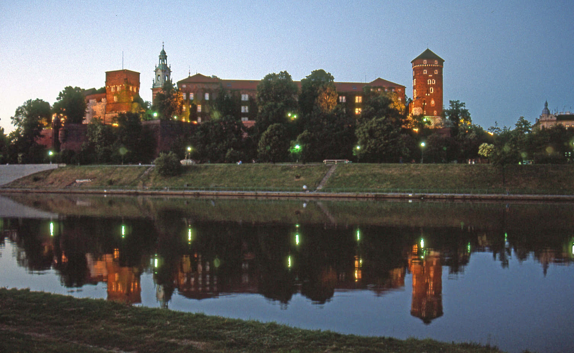 Majestic View Of Wawel Castle With Water Reflection