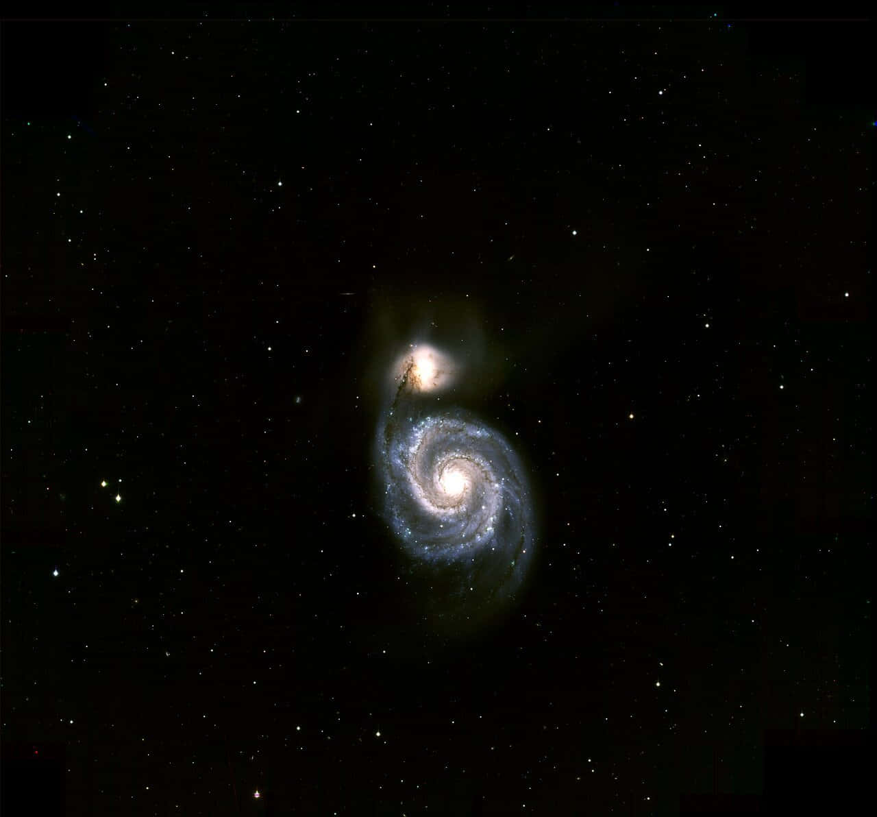 Majestic Whirlpool Galaxy Spiral In Deep Space Background