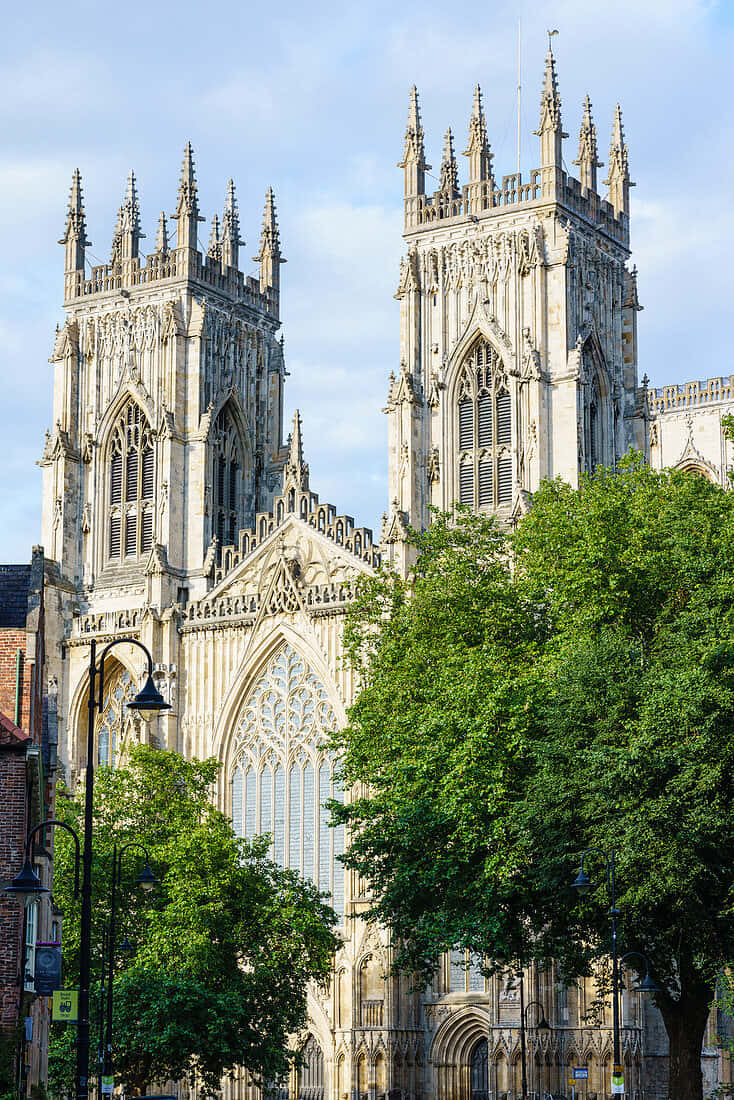Majestic York Minster Cathedral Towers At Sunset Background
