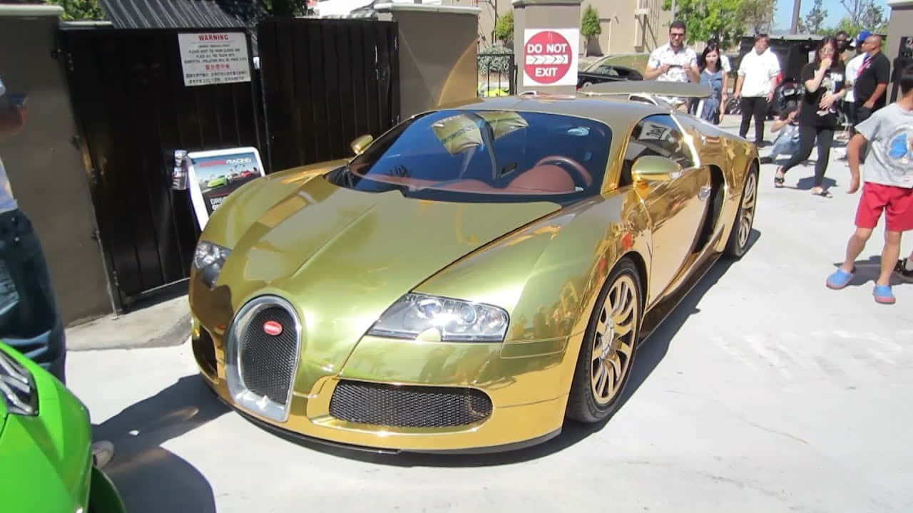 Make A Big Impression With This Limited Edition Gold Bugatti Veyron Background