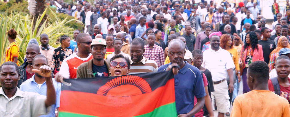 Malawi Supporters Holding Flag