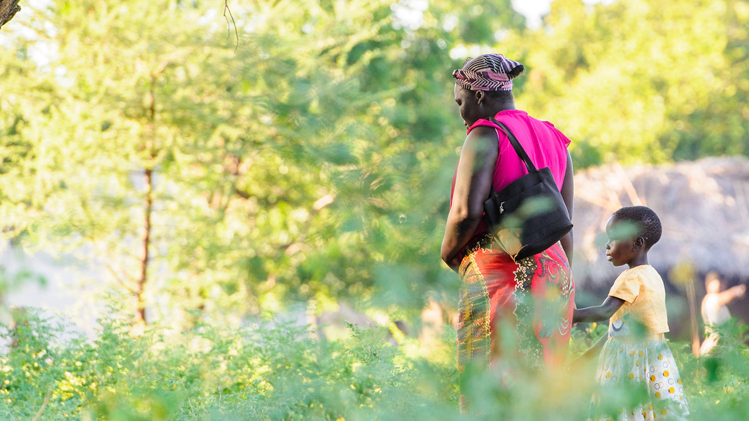 Malawi Woman Walking With Child