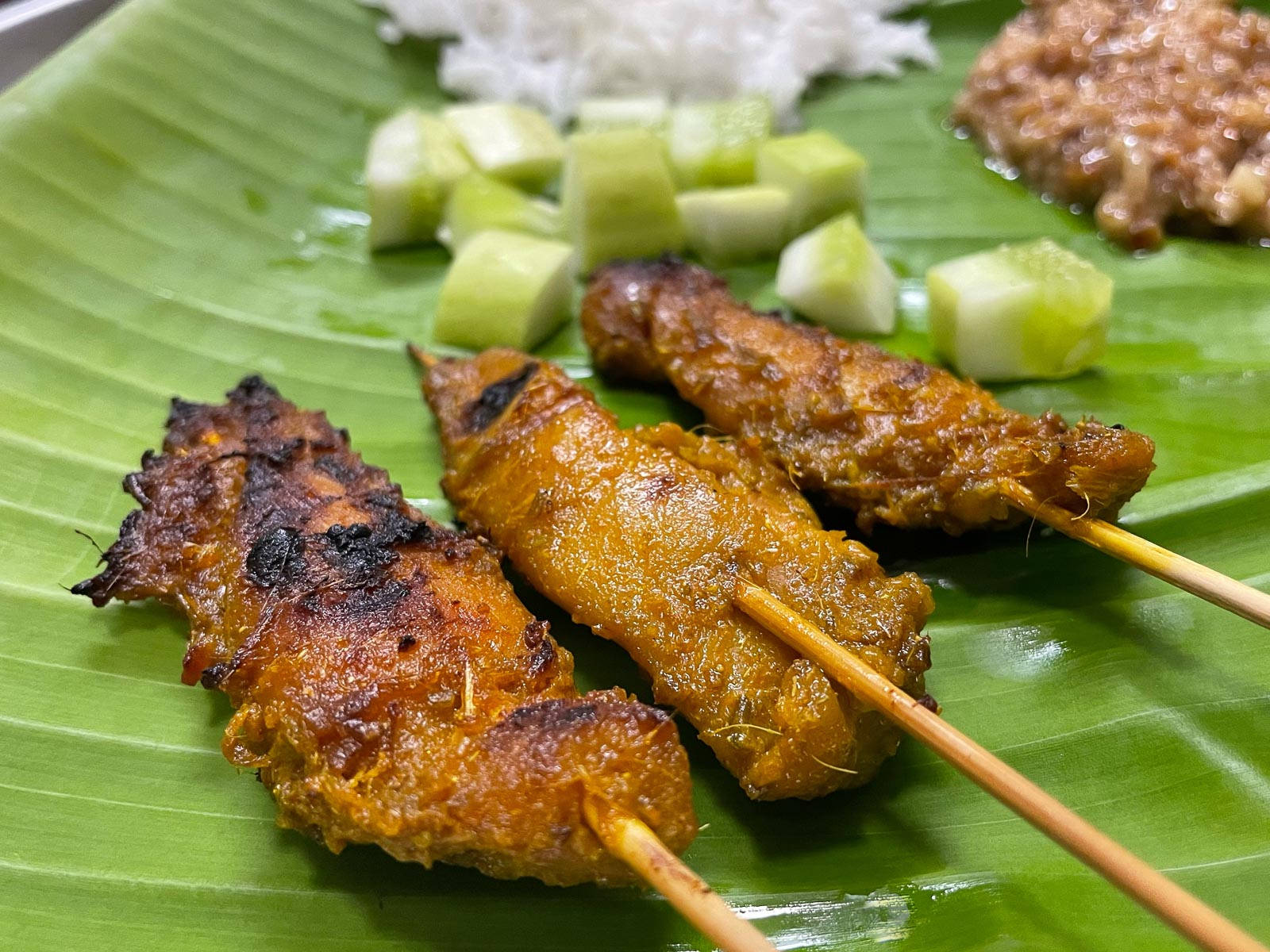 Malay Chicken Satay On Banana Leaf Background