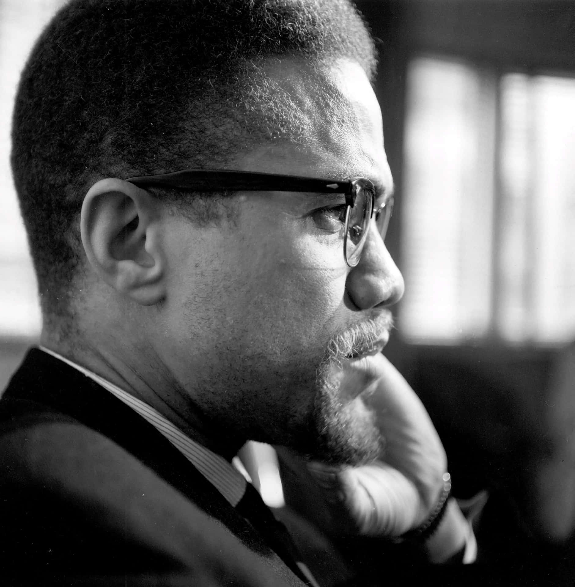 Malcolm X Contemplative Portrait Background
