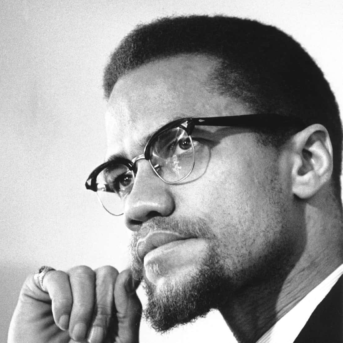 Malcolm X Contemplative Portrait Background