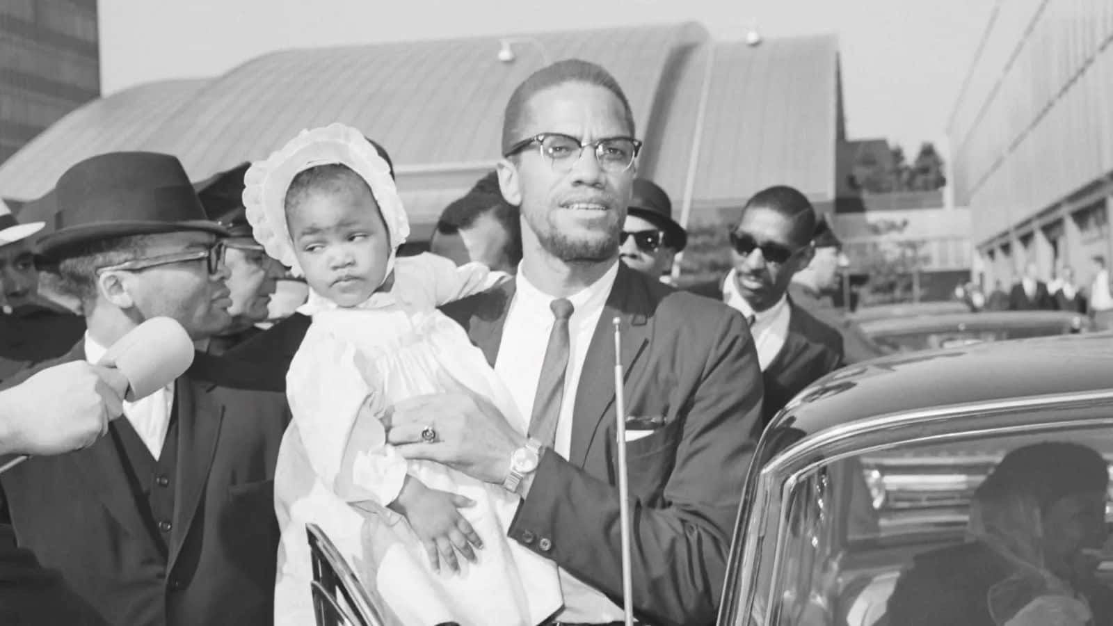 Malcolm_ X_ Holding_ Child Background