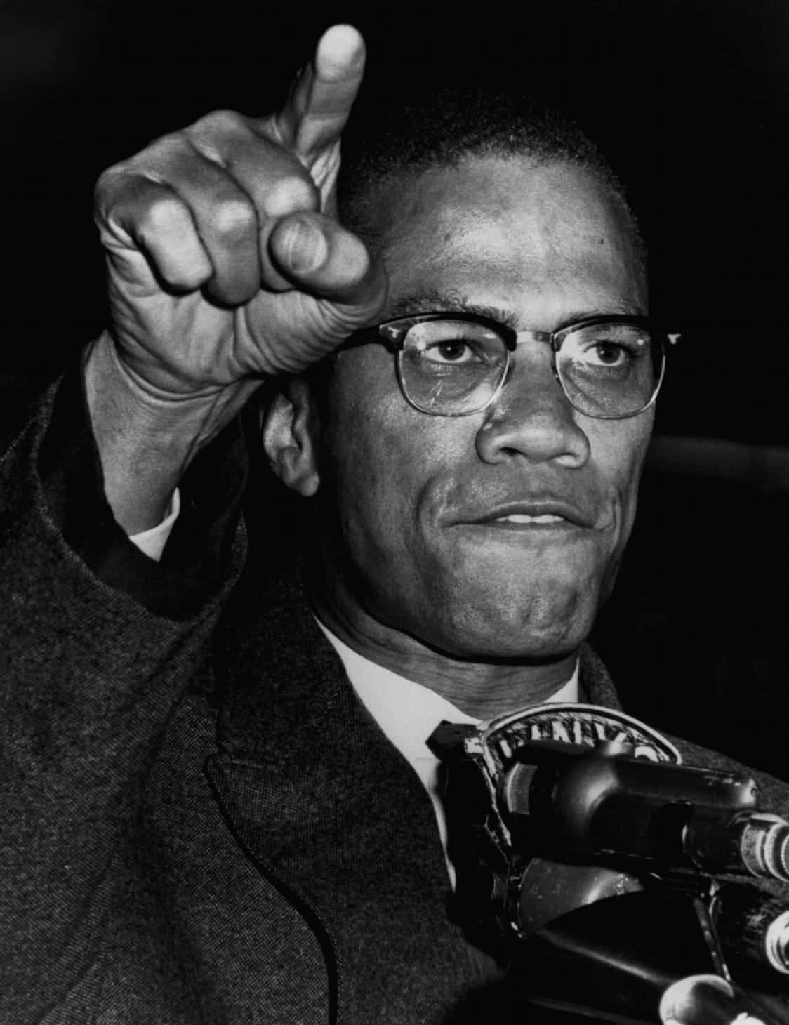 Malcolm X Speaking Pointing Background